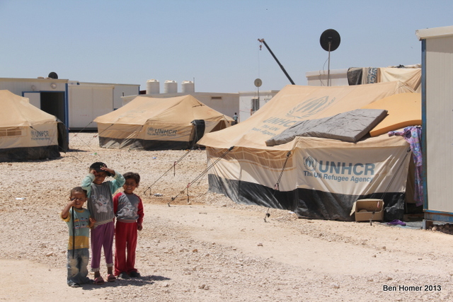 Kids outside tents in Za’atari. An estimated 40% of Za’atari residents are under the age of 16. Nearly every tent and caravan has electricity and Satellite dish. 