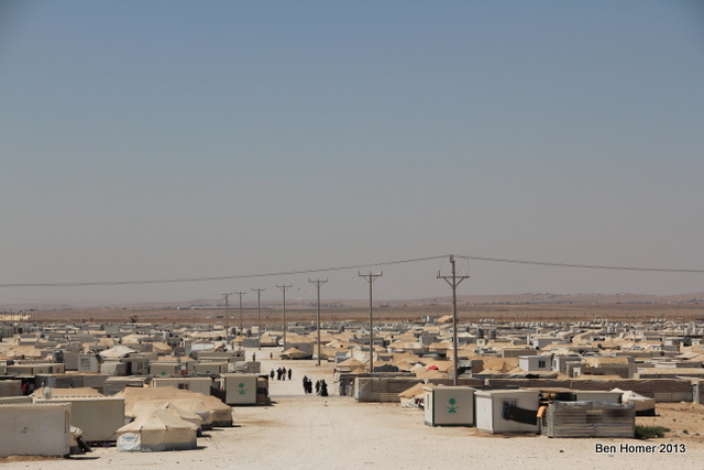 A wide shot of the camp. The rapid growth of the camp has led to many distinct neighborhoods in the camp some of which are hostile to the NGOs. The UN leadership in the camp recently began a program to work with leaders in each area to try to improve cooperation between aid workers and residents. 